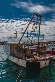 03.07.24 Porec Croatia Fishing boat moored at the pier photo