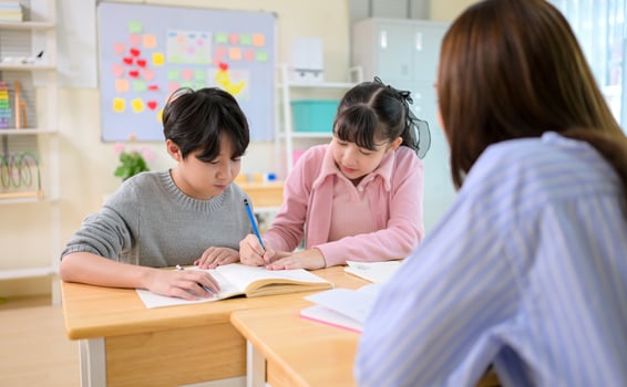 Art lesson, Teacher and students in the basic art classroom photo