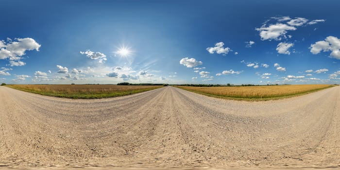 blue sky hdri 360 panorama with awesome clouds on gravel road among fields in spring day in equirectangular full seamless spherical projection, for VR AR content or skydome replacement photo