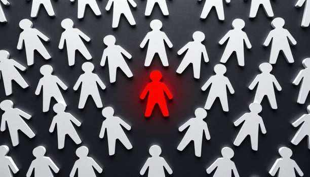 A glowing red figure standing surrounded by white figures, symbolizing leadership and creative idea, Different thinking, Individuality concept photo