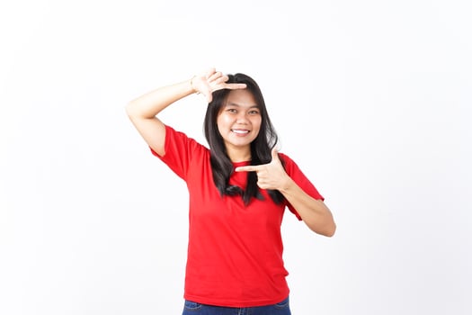 Make Frame With Hands Of Beautiful Asian Woman wearing red shirt Isolated On White Background photo