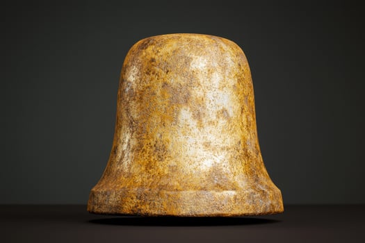 Antique bronze bell on dark background photo