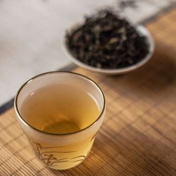 Indulge in a Calming Tea Experience Featuring Natural Leaves Served in a Glass Cup photo