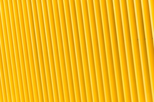 Detail of yellow metal building facade photo