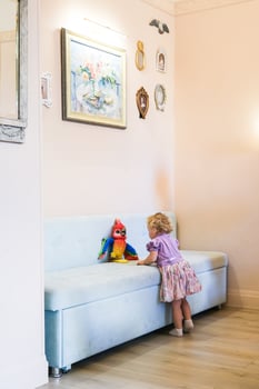 Beautiful blonde baby girl playing in kindergarten photo