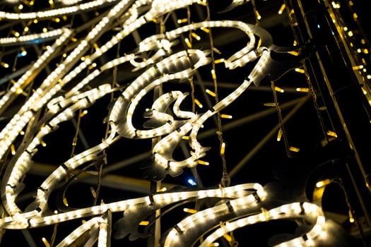 Christmas garland on the street in close-up. Yellow glow photo