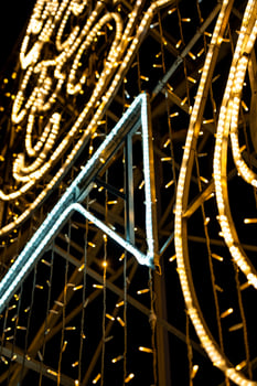 Christmas garland on the street in close-up. Yellow glow photo