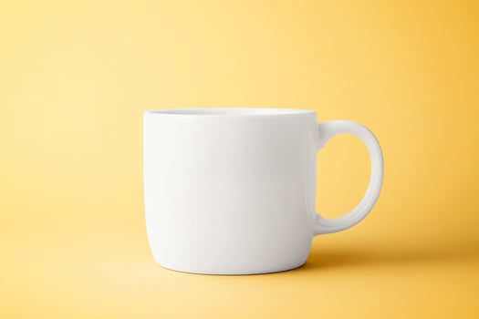 White mug mockup on yellow background photo