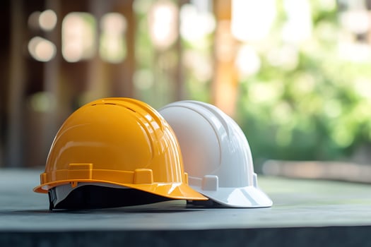 Two hard hats on a table photo