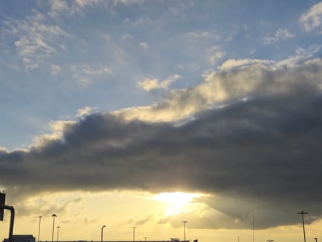 Natural sunset in heavy clouds background wallpaper photo