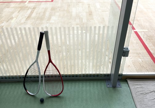 Squash Racket and Ball Sport Played by Two or Four Players. Court Floor and the Rockets photo