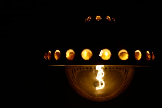 LED filament globe resembling an old carbon filament light bulb photo