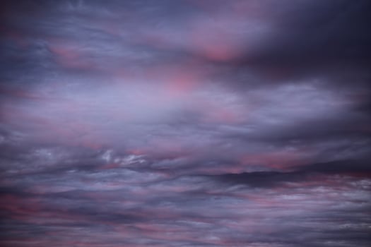 Impressive cloudscape, lightly illuminated by the sun below photo