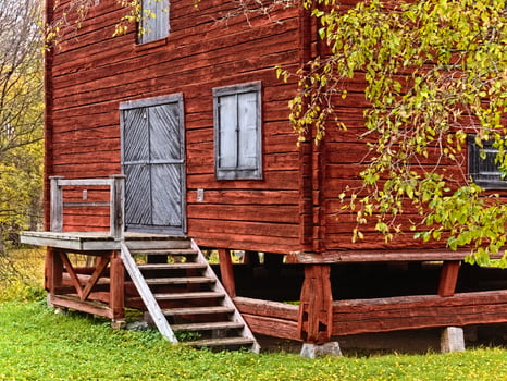 Raised falu red building in church town Bonnstan in Skelleftea photo
