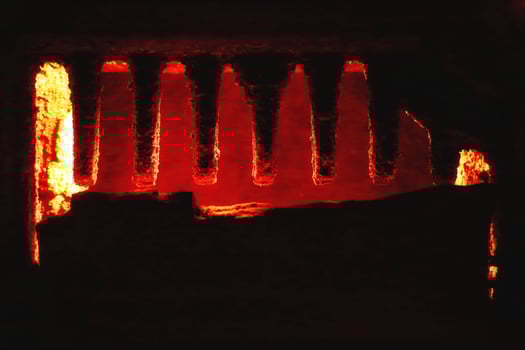 Detail of sooty rack inside an old furnace photo