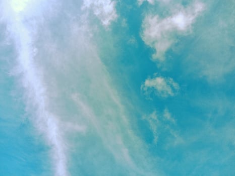 Serene Blue Sky with Diagonal Cloud Streaks photo