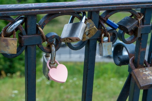 Pink lock in the shape of a heart. Locks for happiness, love and luck. Ritual and superstition. photo