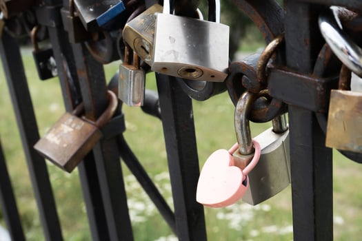 Pink lock in the shape of a heart. Locks for happiness, love and luck. Ritual and superstition. photo