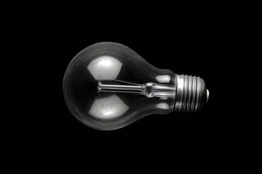 A Close-Up View of an Unlit Incandescent Light Bulb photo
