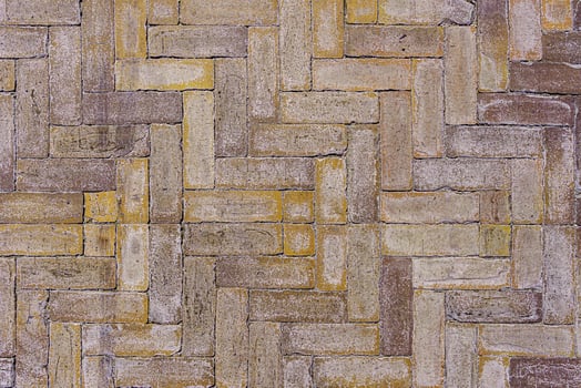 Worn tiled street surface. Abstract construction background. photo