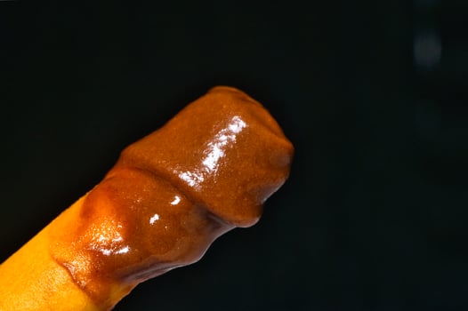 bread stick dipped on chocolate photo