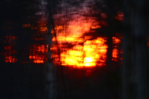 Conceptual blurry shot of glowing orange sunset photo