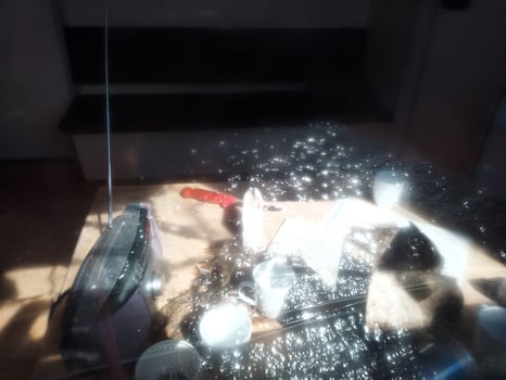 Conceptual shot of light effects in window pane and an abandoned desk photo