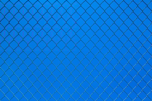 Wire mesh fence with a blue sky photo