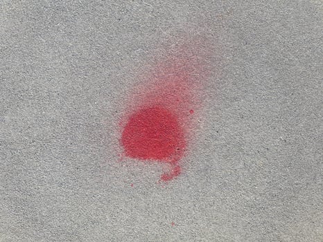 red stain on concrete floor photo