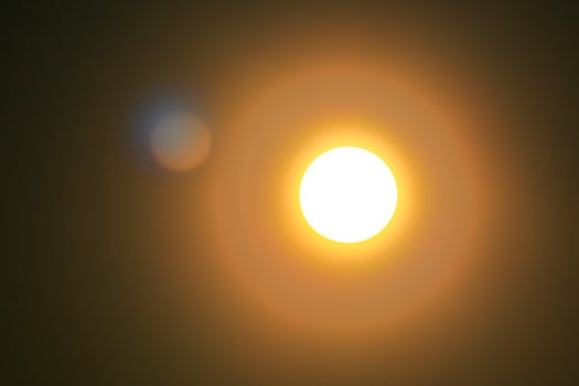 Abstract shot of radiant sun with lens flare photo