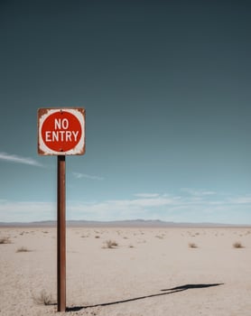 No Entry Sign in Desert Landscape Blue Sky photo