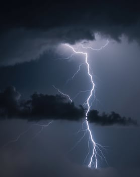 Dark and Moody Storm Cloud Background with Flashes of Dramatic Lightning photo