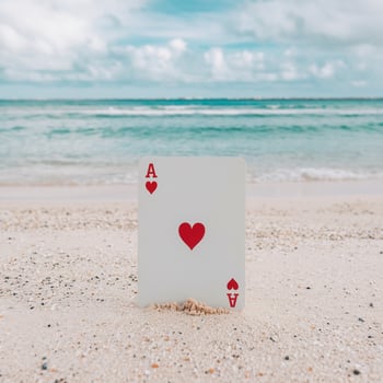Pristine beach with clear turquoise waters, Ace of Hearts card in sand For Social Media Post Size photo