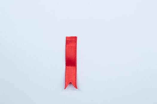 Red ribbon marker isolated on white background photo