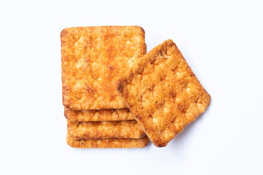 Pile of sweet digestive biscuits isolated on white. photo