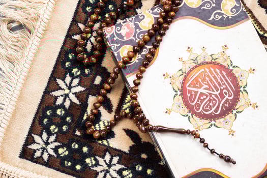Islamic or Ramadan concept photo. Al-Qur'an on the pulpit in top view. The concept of candlesticks or laylat al-qadr. photo
