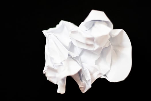 crumpled paper for the texture on black background photo