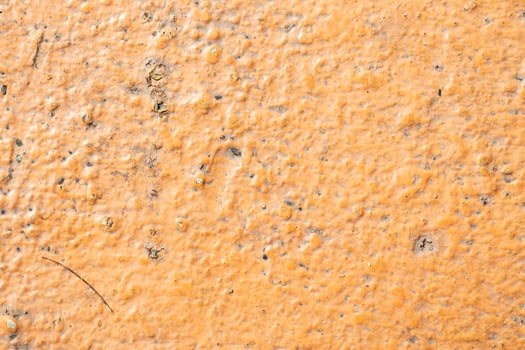 Dirty old yellow stone wall texture background photo