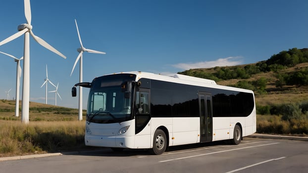 A bus parked next to wind turbines photo