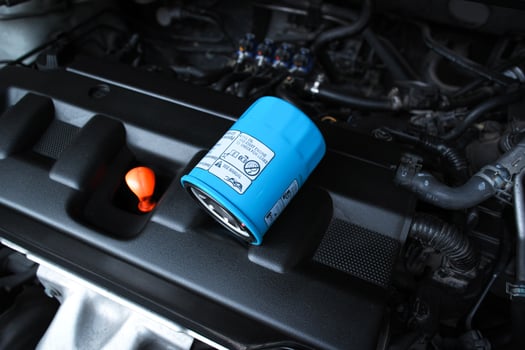 Oil filter in automotive engine compartment , Automotive parts concept photo