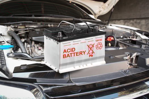 Automotive acid battery on car engine bay , new car battery to replace , Car maintenance concept photo