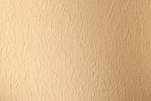 Textured Beige Wall Surface Ideal for Various Background Use in Design and Decor Projects photo