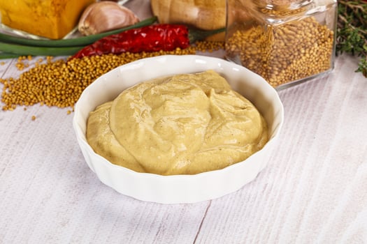 Dijon mustard sauce in the bowl photo
