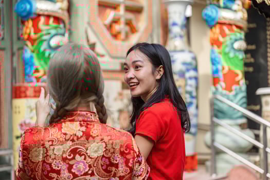 Worshiping at a shrine during chinese new year celebrations urban setting festival cultural atmosphere joyful gathering photo