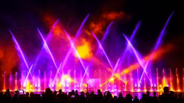 Experience a stunning display of water, light, and music as the fountain show dances against the night sky, creating a captivating spectacle that leaves you enchanted. photo