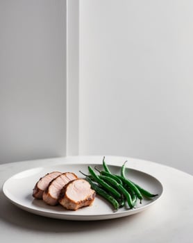 Grilled Pork Tenderloin Slices Served with Green Beans photo