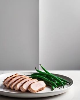 Grilled Pork Tenderloin Slices Served with Green Beans photo