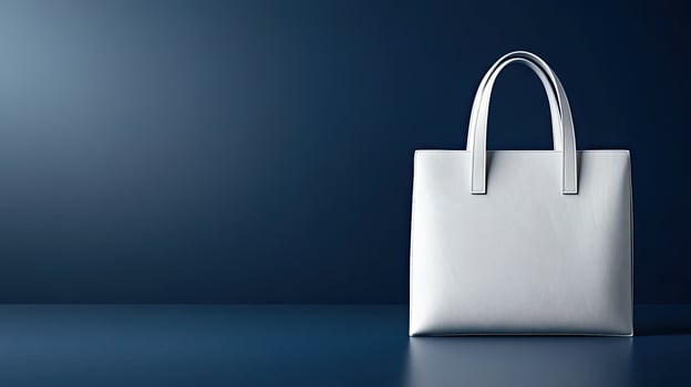 White shopping bag on blue background photo