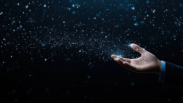 A hand reaching out to the sky with snow falling photo