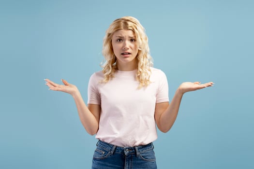Portrait of upset, unhappy teenager, girl wearing casual clothes choosing, looking at camera photo